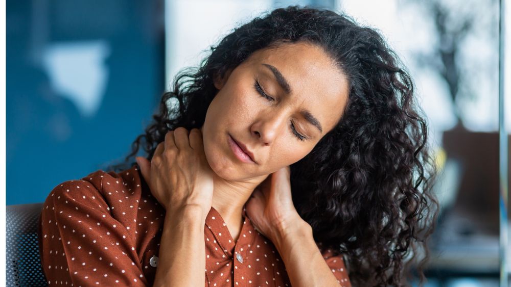 Person Holding Neck Due To Muscle Tension - DR. ARUNAVA DATTA Blog